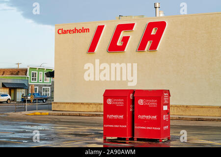 The local small town IGA grocery store located on the main highway through town. Canadian Diabetes Association clothing donation bins in parking area. Stock Photo