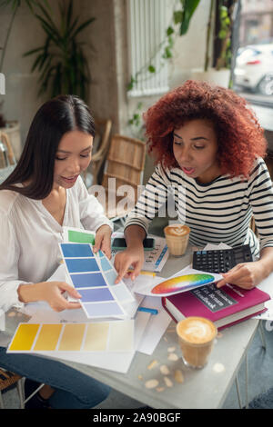 Future interior young designers discussing new project Stock Photo