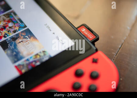Bangkok, Thailand - November 10, 2019: Nintendo Switch's game card in Nintendo Switch's card slot. Stock Photo