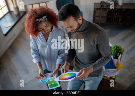 Two talented interior designers choosing color for project Stock Photo