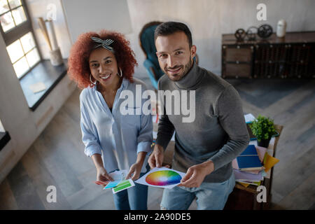 Cheerful interior designers feeling inspired for project Stock Photo