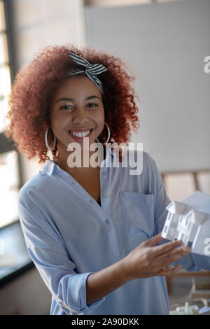 Cheerful young interior designer feeling motivated Stock Photo