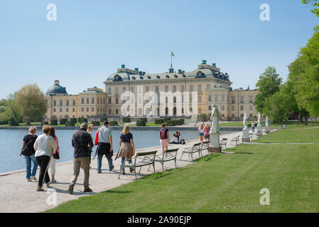 Tourism Europe, view in summer of tourists approaching the Swedish Royal Palace - Drottningholm (Drottningholms Slott) - on Lovön island, Sweden. Stock Photo