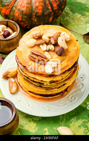 Picture of Pumpkin pancakes with maple syrup and nuts Stock Photo - Alamy