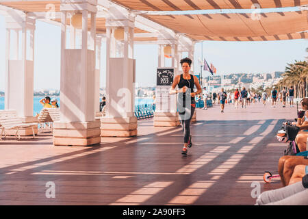 Nice, Provence / France - September 29, 2018: Morning jogging along the boardwalk Stock Photo