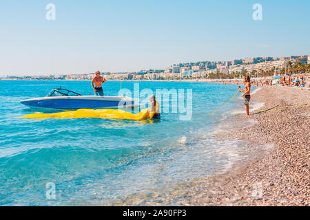 Nice, Provence / France - September 29, 2018: Beach attraction - parasailing - active pastime Stock Photo