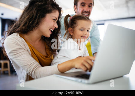 Family, children, happiness technology and home concept. Happy family together Stock Photo