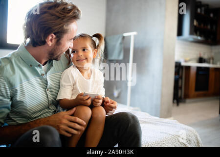 Father and his daughter child girl playing together. Happy loving family Stock Photo