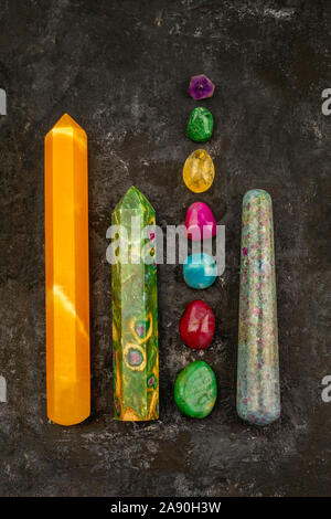 Natural gem geological crystals and colorful stones on a dark texture background Stock Photo