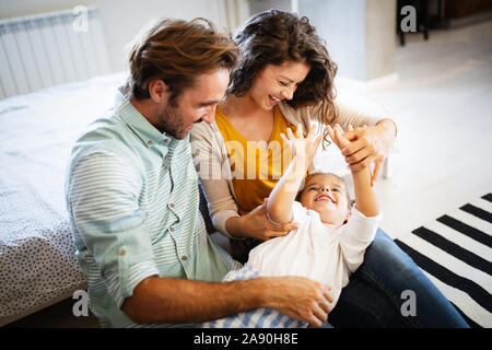 Happy family having fun times at home Stock Photo