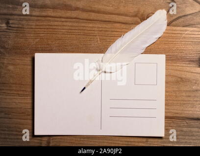 feather and postcard Stock Photo