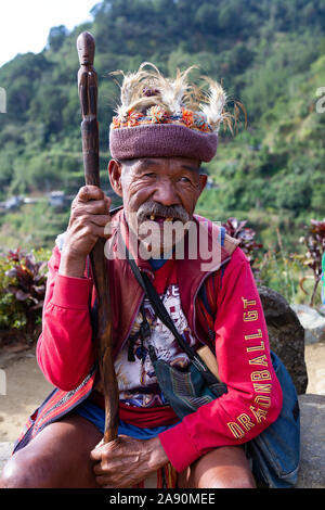 An Igorot man poses for a photograph on the tourist trail near to the rice terraces,Banaue,Philippines Stock Photo