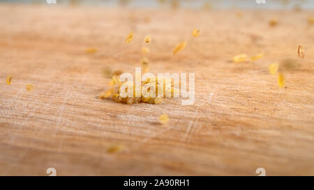 Bulgur raw grits in a pile with grains falling from above Stock Photo