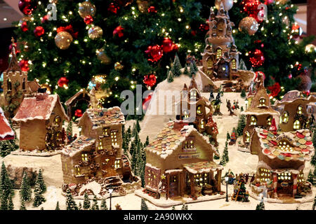 Snowy village diorama decorated with Christmas celebrations Stock Photo