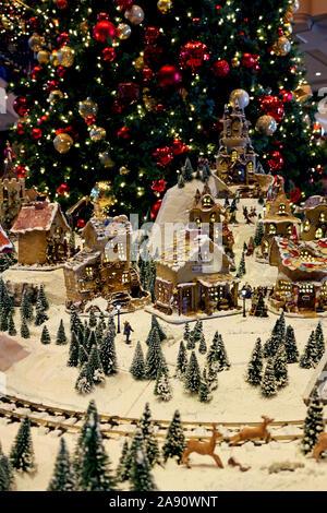 Snowy village diorama decorated with Christmas celebrations Stock Photo