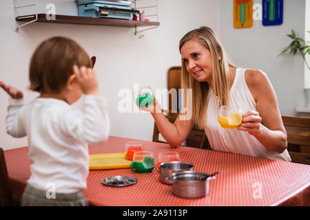 Mother and toddler in kitchen Stock Photo