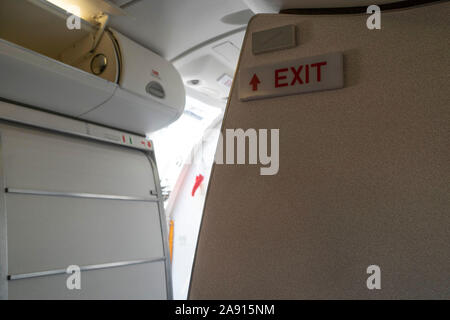 exit sign on airplane detail Stock Photo