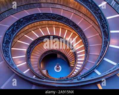 ROME, ITALY - OCTOBER 21, 2019: The Bramante Staircase is a double helix, having two staircases allowing people to ascend without meeting people desce Stock Photo