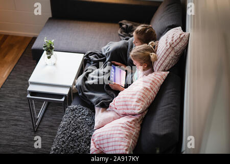 Girls using digital tablet Stock Photo