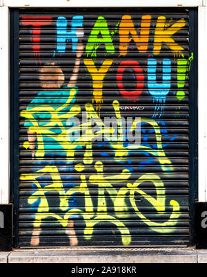 Street art painting "Thank You" on metal door shutter - Brussels, Belgium. Stock Photo