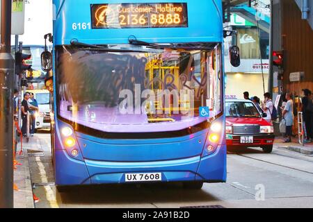 Hong Kong. 11th Nov, 2019. Clashes break out in several districts between protesters and police after a protester got shot by the police and a man was set on fire by protesters during what appeared to be a dispute. Here protesters have sprayed paint on bus windshield so it will be out of service and block the street. Credit: Gonzales Photo/Alamy Live News Stock Photo