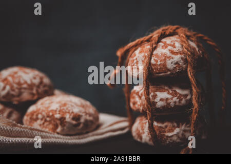 fresh gingerbread cookies tied with a rope on the table Stock Photo