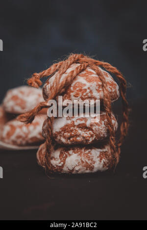 fresh gingerbread cookies tied with a rope on the table Stock Photo