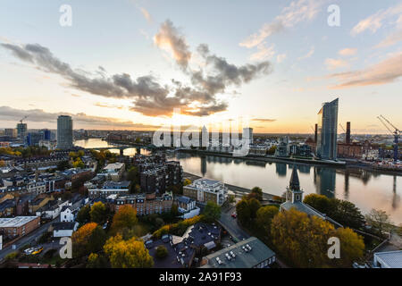 The Sun sets over Battersea and The River Thames. Stock Photo