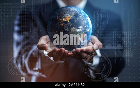 Businessman Holding Earth. Globalization in Business Concept Stock Photo