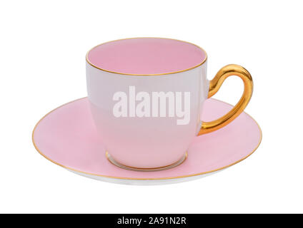 Pretty pink and white classic cup and saucer with gold handle, isolated on white background. Traditional style, retro or vintage. Stock Photo