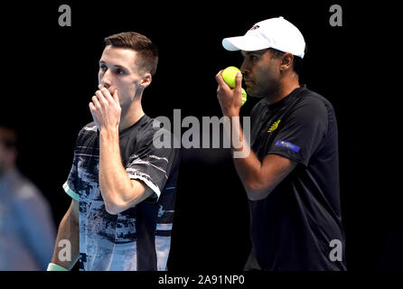 Joe Salisbury (left) and Rajeev Ram during their doubles match on day three of the Nitto ATP Finals at The O2 Arena, London. Stock Photo