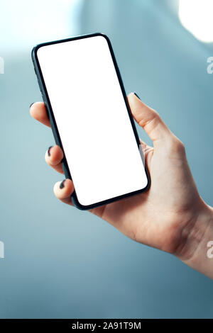 Close-up image of female hands using smartphone at the office. Human resources, management or social networks concept - Image Stock Photo