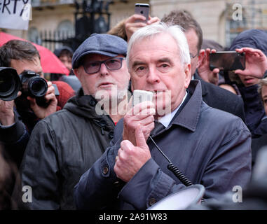 Westminster, London, UK. 12th November 2019. John McDonnell, Labour MP and Shadow Chancellor of the Exchequer addressing McDonalds employees from the London region striking in front of 10 Downing Streets promising reforms as part of a Labour government to increase minimum wages and protect the rates of the working poor.