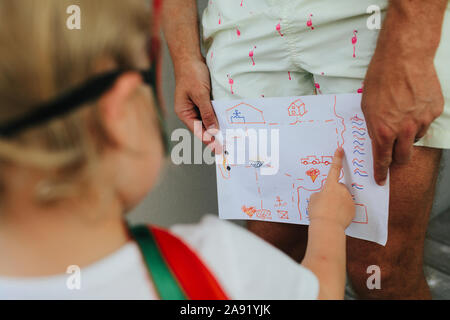 Child pointing at picture Stock Photo