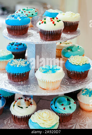 Blue and white cupcakes on plate Stock Photo