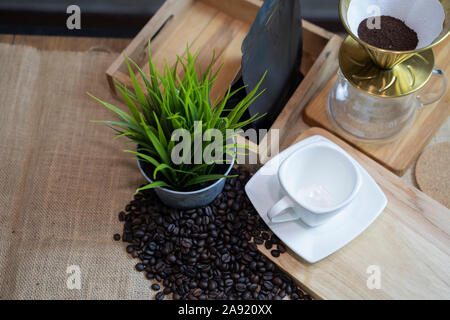 Ground coffee beans inside the filter at the coffee level to prepare drip coffee. Stock Photo