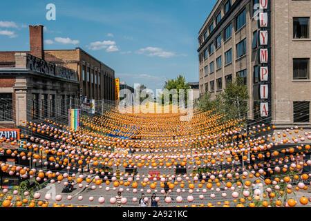 Color balls handing from St. Catherine Street in Montreal, Quebec Stock Photo