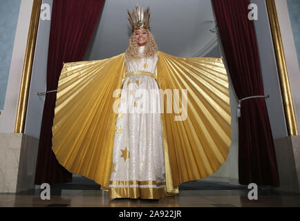 Nuremberg, Germany. 12th Nov, 2019. Benigna Munsi, the new Nuremberg Christ Child, is standing in her robe at the Nuremberg State Theatre during the official costume rehearsal. The 17-year-old was chosen as the Christ Child for the next two years and will traditionally open the Nuremberg Christkindlesmarkt on 29 November. Credit: Daniel Karmann/dpa/Alamy Live News Stock Photo