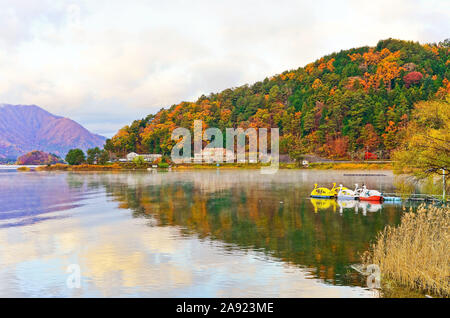 View of the colorful forest at Lake Kawaguchi in Japan in autumn morning.
