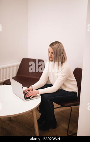 Businesswoman using laptop Stock Photo