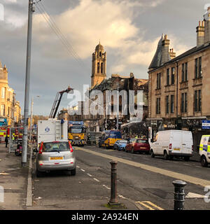 The scene at Albert Drive in Pollokshields, Glasgow, where firefighters are still putting out the blaze that caused a tenement building to collapse. Stock Photo