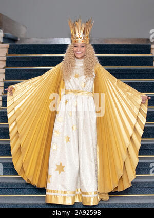 Nuremberg, Germany. 12th Nov, 2019. Benigna Munsi, the new Nuremberg Christ Child, is standing in her robe at the Nuremberg State Theatre during the official costume rehearsal. The 17-year-old was chosen as the Christ Child for the next two years and will traditionally open the Nuremberg Christkindlesmarkt on 29 November. Credit: Daniel Karmann/dpa/Alamy Live News Stock Photo