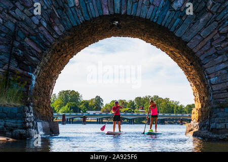 Women paddle boarding Stock Photo