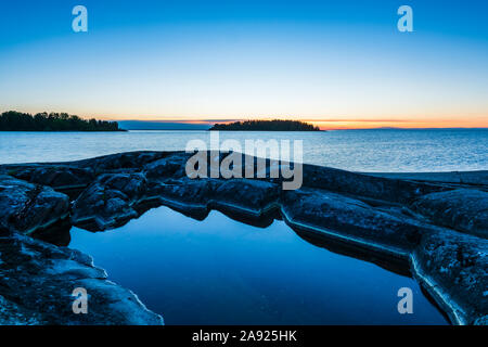 Rocky coast at sunset Stock Photo
