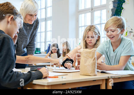 Children with teacher in classroom Stock Photo