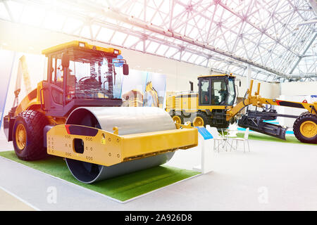 New road roller and motor grader on exhibition Stock Photo