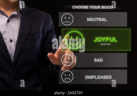Unrecognizable man using selecting his mood online Stock Photo