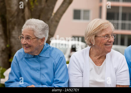 Two women watching a game Stock Photo