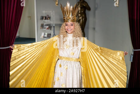 Nuremberg, Germany. 12th Nov, 2019. Benigna Munsi, the new Nuremberg Christ Child, is standing in her robe at the Nuremberg State Theatre during the official costume rehearsal. The 17-year-old was chosen as the Christ Child for the next two years and will traditionally open the Nuremberg Christkindlesmarkt on 29 November. Credit: Daniel Karmann/dpa/Alamy Live News Stock Photo