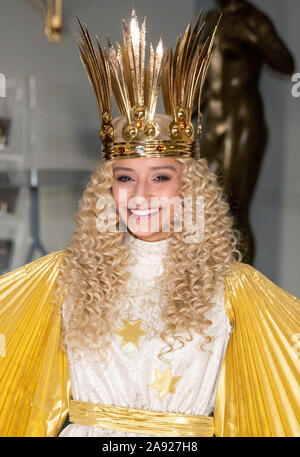 Nuremberg, Germany. 12th Nov, 2019. RECROP - Benigna Munsi, the new Nuremberg Christkind, is standing in her robe at the Staatstheater Nürnberg during the official costume rehearsal. The 17-year-old was chosen as the Christ Child for the next two years and will traditionally open the Nuremberg Christkindlesmarkt on 29 November. Credit: Daniel Karmann/dpa/Alamy Live News Stock Photo